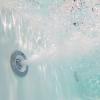 imageEmpava 59quot Freestanding Whirlpool Tub with Center DrainStand Alone Bathtub with 8 Hydromassage Jets BoatShaped DesignAcrylicETL CertificatedWhite